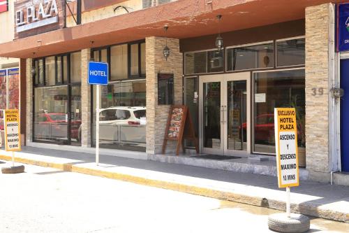 a store with signs in front of a building at Hotel Plaza in Tuxpan de Rodríguez Cano