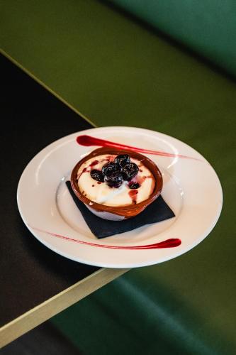 a dessert on a plate on a table at ibis Styles Castelnaudary in Castelnaudary