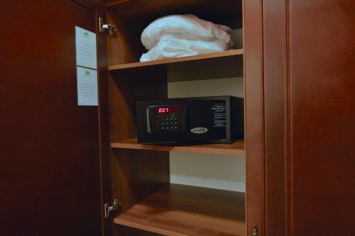 a microwave sitting on a shelf in a cabinet at Hotel Hastal Prague Old Town in Prague
