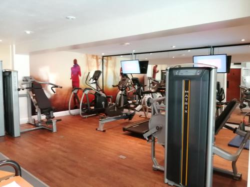 a gym with treadmills and elliptical machines at Best Western Plus Angel Hotel in Chippenham