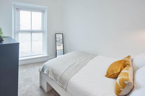 Ένα ή περισσότερα κρεβάτια σε δωμάτιο στο Host & Stay - 39 Marine Parade