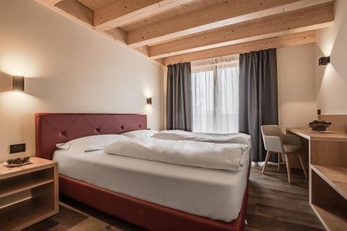 מיטה או מיטות בחדר ב-Chalet Alpenrose