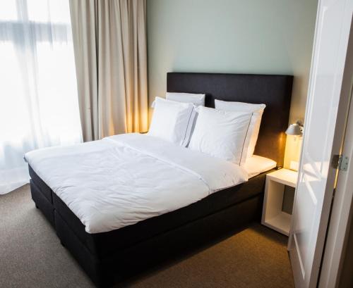 Ein Bett oder Betten in einem Zimmer der Unterkunft Apartments Prinsengracht