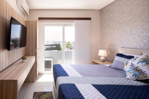 Postelja oz. postelje v sobi nastanitve Equipetrol Suites apart hotel