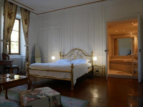 En eller flere senge i et værelse på Hotel Du Parc - Manoir Du Baron Blanc