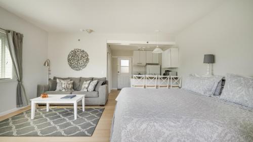 a living room with a large bed and a couch at Windward Shores in Amagansett