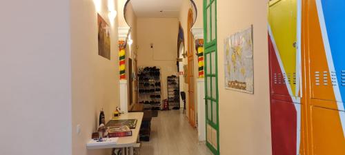 a hallway of a shop with surfboards on the walls at Dja Hostel in Kyiv