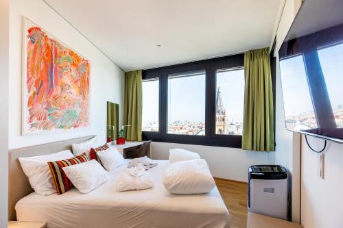 Skyflats Vienna - Rooftop Apartmentsにあるテレビまたはエンターテインメントセンター