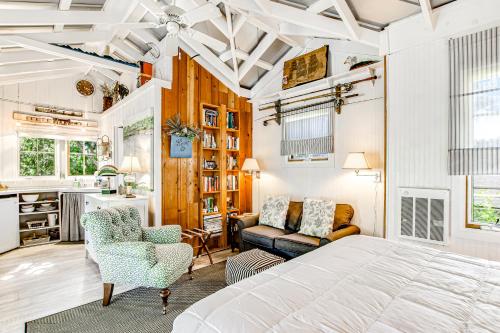 a bedroom with a bed and a living room at Baby Breezy Tree House in Demere Park