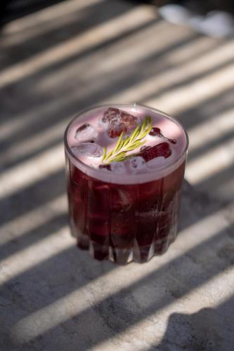 a drink in a glass sitting on a table at Encuentro Guadalupe in Valle de Guadalupe
