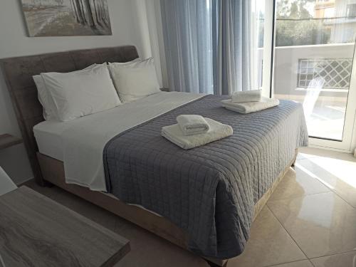 Posteľ alebo postele v izbe v ubytovaní Cyclops Luxury Apartments