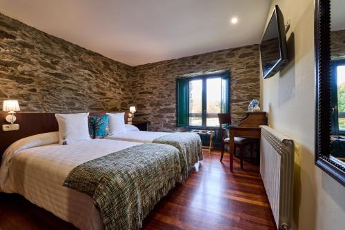 Postel nebo postele na pokoji v ubytování Lar da Mota Boutique Hotel
