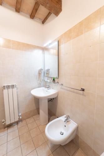 a bathroom with a sink and a toilet at Albergo La Loggia di San Martino in Gualdo Tadino