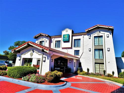 a hotel with a sign on the front of it at Quality Inn Hampton - Newport News in Hampton