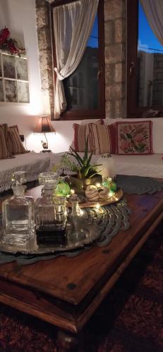 a table with a tray of food on top of a bed at Guesthouse Petrino in Pezoúla