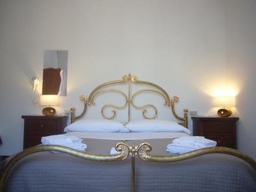 Ένα ή περισσότερα κρεβάτια σε δωμάτιο στο BeeLiving Room&Breakfast