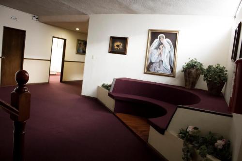 a hallway with a altar and a painting on the wall at HOTEL ROMO in Ciudad Hidalgo