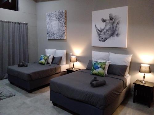 Llit o llits en una habitació de Fijnbosch Game Lodge Jeffreys Bay
