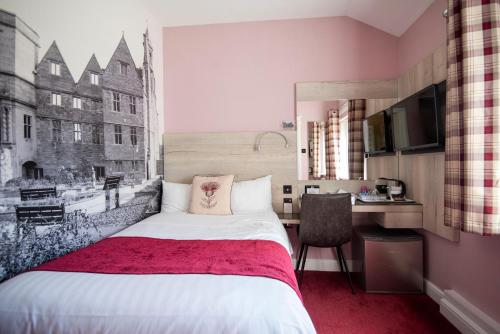 מיטה או מיטות בחדר ב-Bridleways Guesthouse & Holiday Homes
