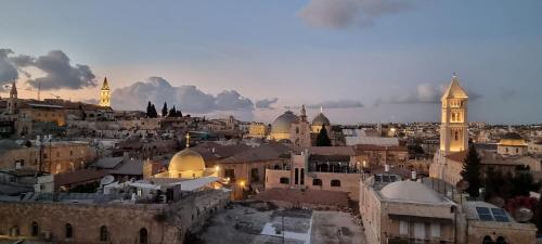 an aerial view of a city with a clock tower at New Citadel Hostel in Jerusalem