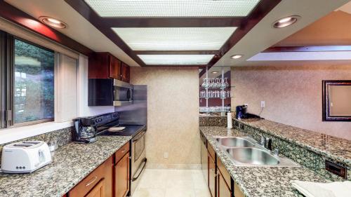 a kitchen with granite counter tops and a sink at Tahoe Chaparral in Incline Village