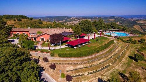an aerial view of a estate with a swimming pool at Faro Rosso in Montanaldo