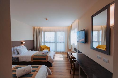 Postel nebo postele na pokoji v ubytování SEC Hotel