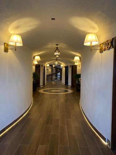 a hallway of a hotel with a long hallwayngth at SANTA CECILIA LA MORA HUASCA in Huasca de Ocampo