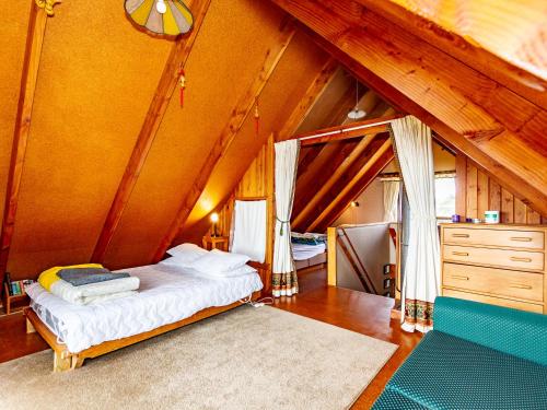 a bedroom with a bed in a room with an attic at Green Gables - Raetihi Holiday Home in Raetihi
