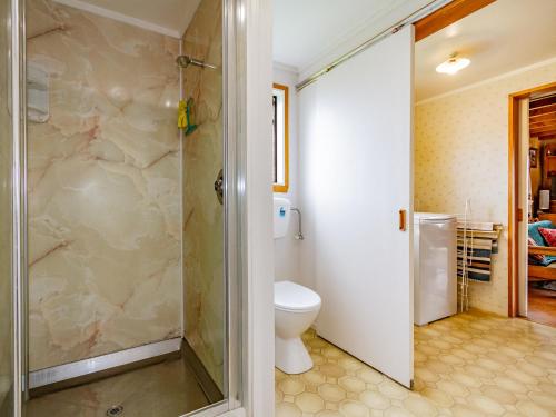 a bathroom with a shower and a toilet at Green Gables Raetihi - Ohakune Holiday Home in Raetihi