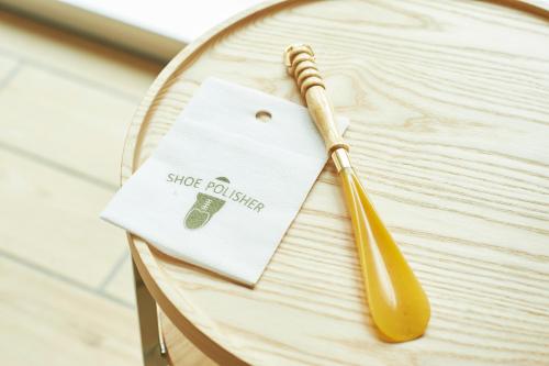 a wooden spoon sitting on a wooden table at Sotetsu Fresa Inn Daimon in Tokyo