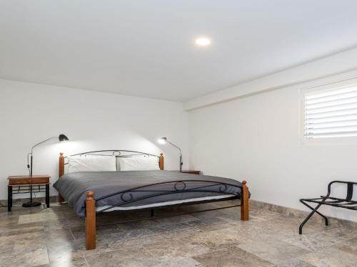 A bed or beds in a room at Across The Road From The Beach inlet side