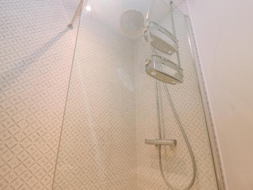 a shower with a shower head and a shower head at Bridge Studio in Broad Chalke