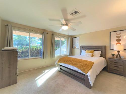 a bedroom with a bed and a ceiling fan at Luxe 4BR 2BTH l Pool & Grill l Central Location l Mountain View l Family Vacation l RV Site in Sierra Vista