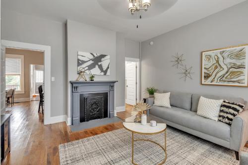 a living room with a couch and a fireplace at Recently Renovated Home in the Heart of Bellevue! home in Bellevue