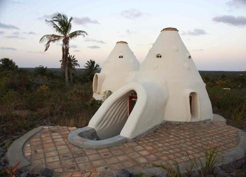 a house with a slide in front of it at Mafu Haus in Inhambane