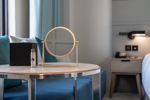 a mirror on a table in a room at Greet Inn in Kaohsiung
