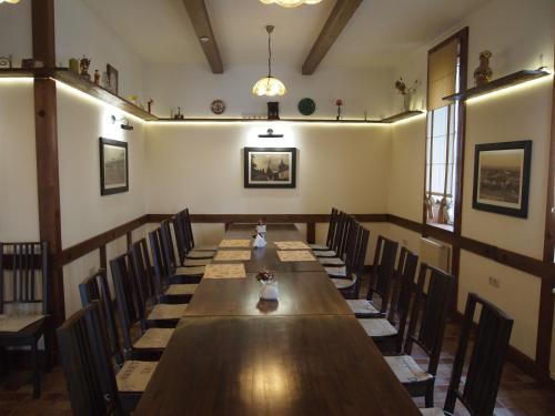 a conference room with a long table and chairs at Tulipan Hotel Aquapark in Vyshkove
