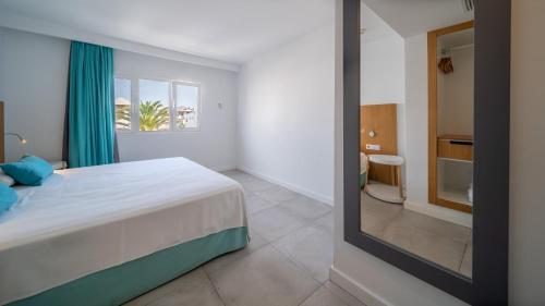Katil atau katil-katil dalam bilik di Guinate Club Apartamentos