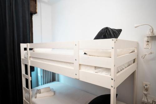 Katil atau katil-katil dalam bilik di HiHome Hostel Uría