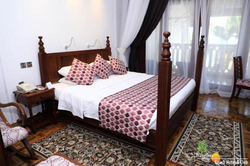 Travellers Beach Hotel & SPAにあるベッド
