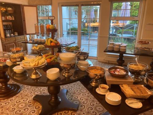 a table with a bunch of food on it at The Keadeen Hotel in Newbridge