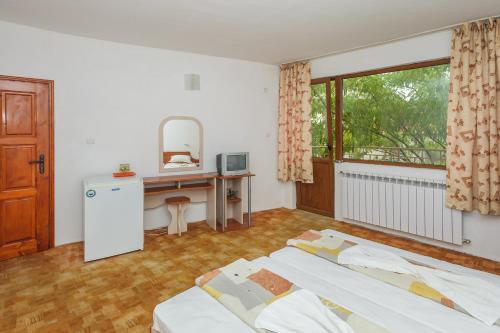 Ένα ή περισσότερα κρεβάτια σε δωμάτιο στο Guest House Galema
