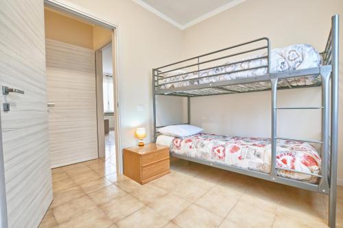Våningssäng eller våningssängar i ett rum på Exclusive Villa le Palme