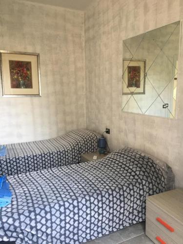 Ένα ή περισσότερα κρεβάτια σε δωμάτιο στο Vicino al mare