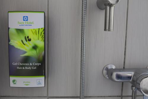 a close up of a door with a sign on it at Sure Hotel by Best Western Lille Tourcoing Ex Hotel Garden in Bondues