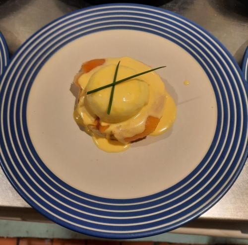 a blue and white plate with a dessert on it at Argyle Guest House in Tomintoul