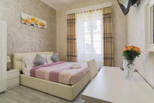 Letto o letti in una camera di Rome Place