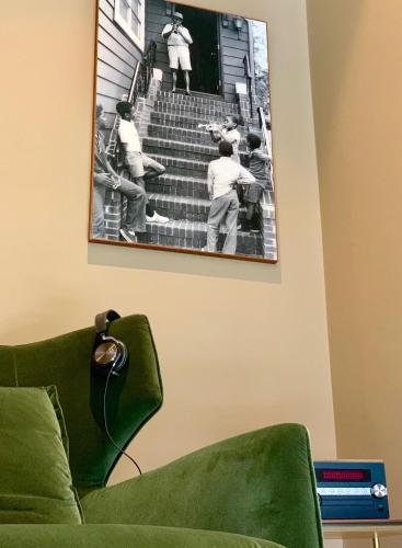 a picture of a baseball game hanging on a wall at PortoBay Flores in Porto