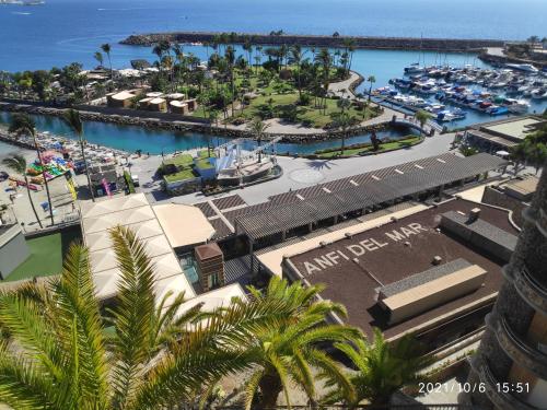 an aerial view of a marina with boats in the water at Anfi del Mar 1 in La Playa de Arguineguín